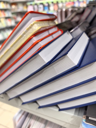 A collection of brightly colored notebooks stands prominently on a store shelf, showing various hues...