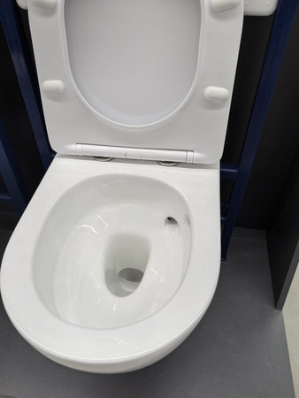 A sleek and modern toilet is showcased in a restroom, featuring a clean, minimalistic design.の写真素材