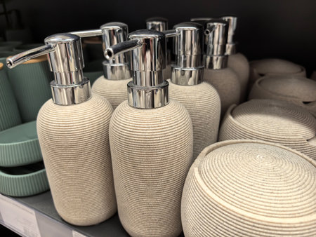 Stylish bathroom accessories made of textured materials are neatly arranged on a retail shelf. Each item showcases a natural aesthetic perfect for contemporary interiors.の写真素材