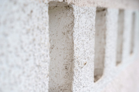 A close examination of a textured wall highlights the interplay of light and shadow. The subtle...