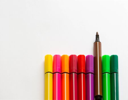 Multi-colored markers on a white background. School Suppliescopyspace for text.
