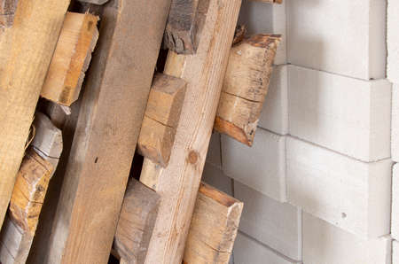 wooden pallets in a warehouse, cart of white bricks.