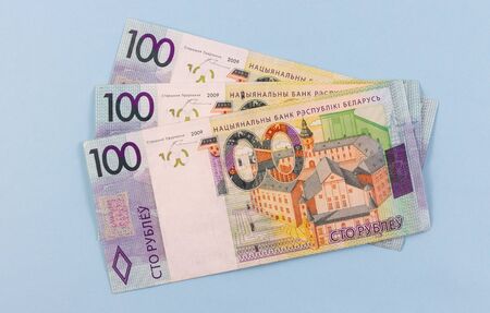 Belarusian money after devaluation. Salary or credit. Nomination one hundred rubles on a blue...