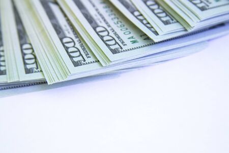 A lot of one hundred dollar bills isolated on white.copyspace for text