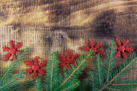 Christmas mock up on wooden background. Live spruce, snowflake decoration. copyspace for text.の写真素材