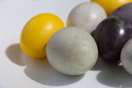 easter colored eggs on a white background close-up. spring holiday concept