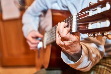 Female guitarist playing on guitar