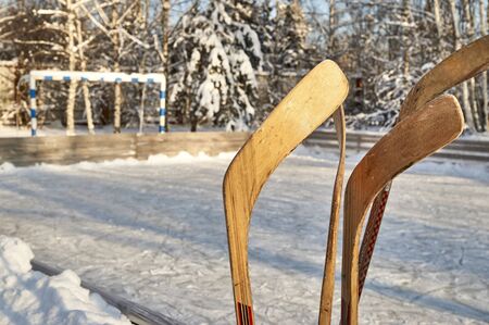 Hockey sticks on ice rink