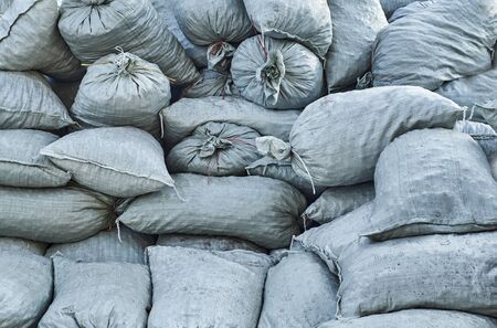 Big pile of full dirty bagsの写真素材