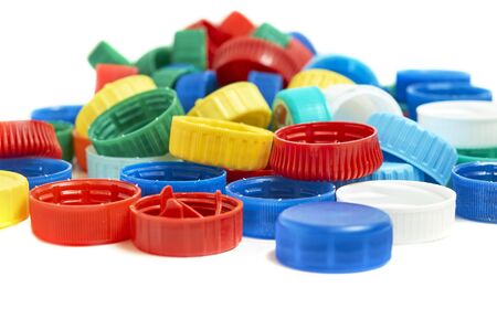 Colorful plastic bottle caps isolated on white backgroundの写真素材