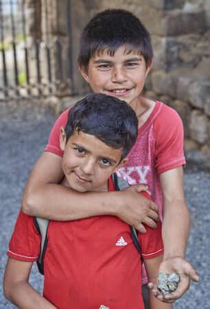 Akhtala,Armenia-6 june,2017. Poor armenian children sell chalcopyrite to foreignersのeditorial素材