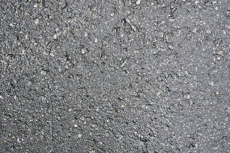 Background with a surface of wet asphaltの写真素材