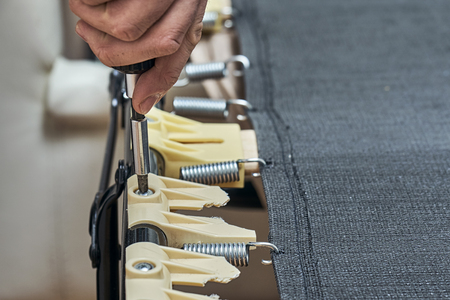 Replacing broken plastic bed slat holdersの写真素材