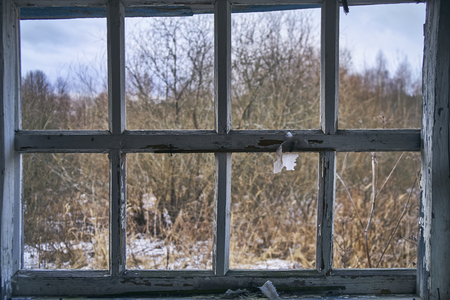 Window without glass of abandoned houseの写真素材