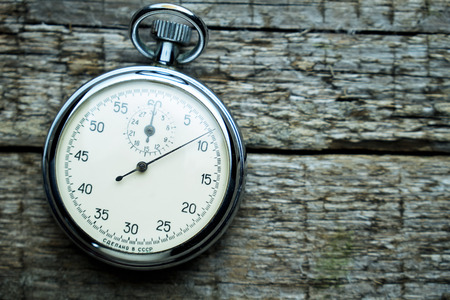 Vintage soviet stopwatch on the wooden boardsの写真素材