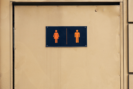 Signs of man and woman on the door of street Moscow toiletの写真素材
