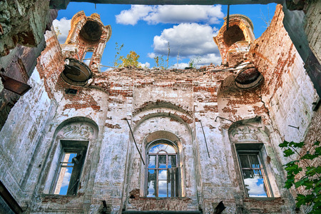 Inside of abandoned destroyed roofless church in russian villageの写真素材