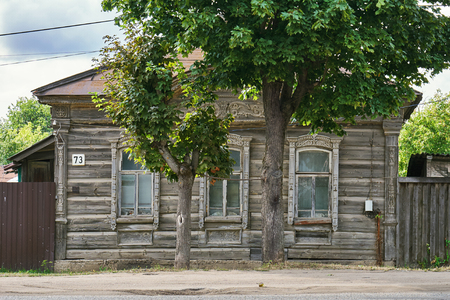 August 30, 2018. Old traditional russian wooden house with carved window framesのeditorial素材