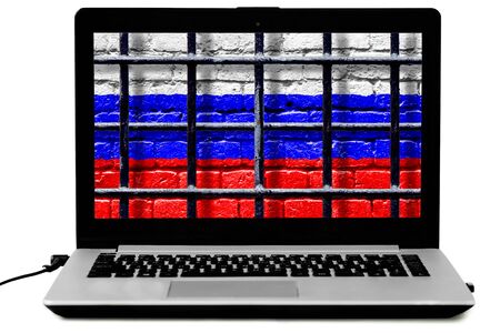 Personal laptop with prison bars and Russian flag painted on a brick wall on the screen isoalted on the white background. Law of disconnecting Russian Internet from the world wide web comceptの写真素材