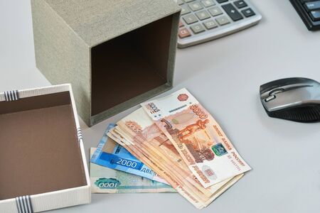 Bonus money lying on a working table in the office. A manager received a reward from his superiors for good workの写真素材