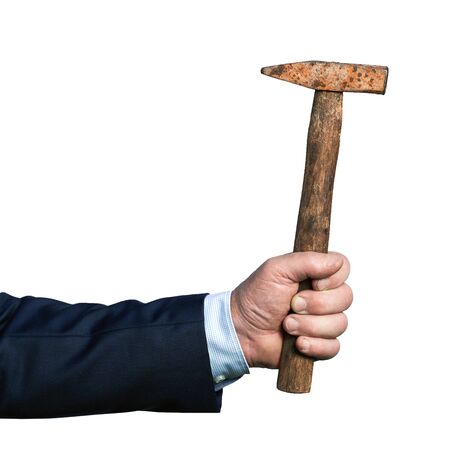 Hand of a businessman holding an old rusty hammer isolated on whiteの写真素材