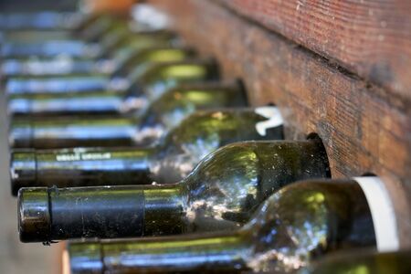 Wine bottles stacked in the special wooden racksの写真素材