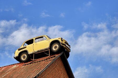 Moscow region, Russia - July 15, 2019: Old soviet car on a roof of a garageのeditorial素材