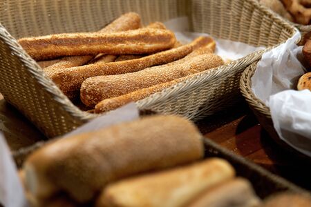 Tasty bread sold in a little store on Haifa street in Israel. Bread lies in wicker baskets outdoors.
