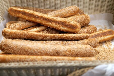 Tasty bread sold in a little store on Haifa street in Israel. Bread lies in wicker baskets outdoors.