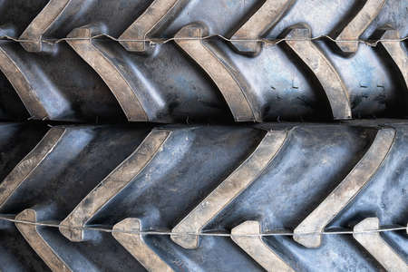 Background with two big tractor tires lying on top of each otherの写真素材