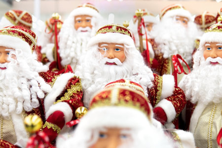 Faces of Santa Claus dolls in the store on the eve of Christmas and New Yearの写真素材