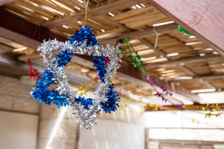 Star of David made from blue and silver tinsel on Sukkot holidayの写真素材