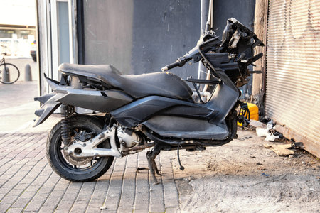 Broken motorcycle without a front wheel on the streetの写真素材