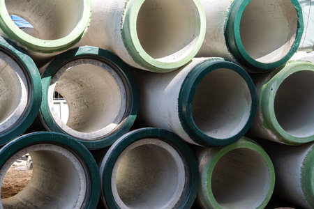 Background with concrete drainage pipes stacked