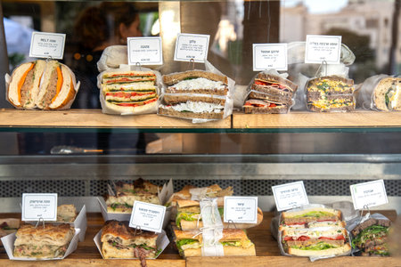 Tel Aviv, Israel - March 29, 2024.Various sandwiches on the counter at a street Cafe in Tel Avivのeditorial素材