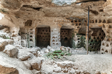 Ancient Rock-Cut Dovecote with Nesting Holesの写真素材