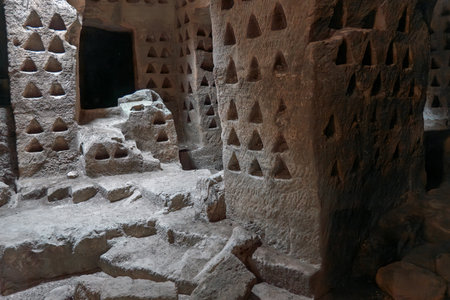 Ancient Rock-Cut Dovecote with Nesting Holesの写真素材