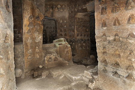 Ancient Rock-Cut Dovecote with Nesting Holesの写真素材