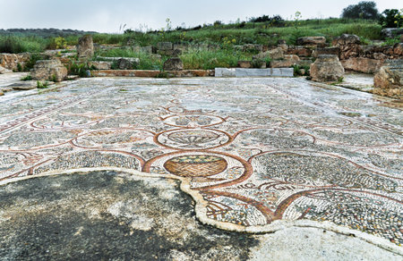 Ancient Mosaic Floor Among Ruins of Broken Medieval Church in Israelの写真素材