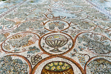 Ancient mosaic floor with beautiful geometric patterns of the floral and fruit motifsの写真素材