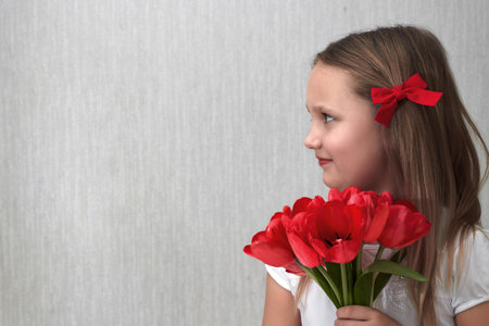 beautiful girl portrait with flowers on monochrome backgroundの写真素材