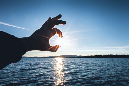 Touch the Sun Reflected on Water Landscapeの写真素材