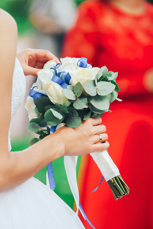 Bride in Wedding Dress with Wedding Bouquet in Handの写真素材