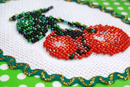 Fragment of beautiful color beadwork close up