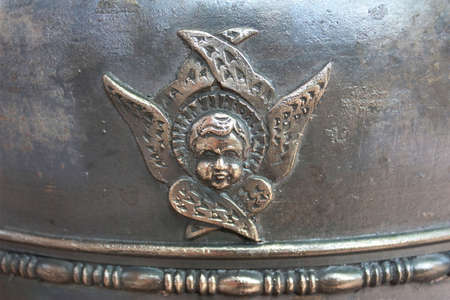 The image of an angel on a metal surface の写真素材