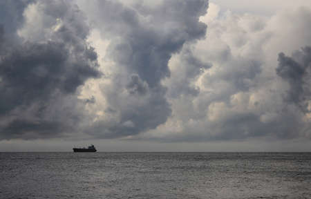Sea landscape with the ship on a background of storm clouds, the Black sea