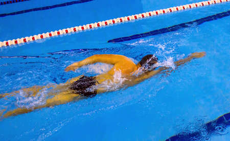 Young teen swimmer in the swimming poolの写真素材