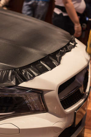 carbo fiber vinyl car hood working processの写真素材