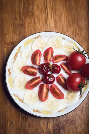 Tomatoes in the plateの写真素材