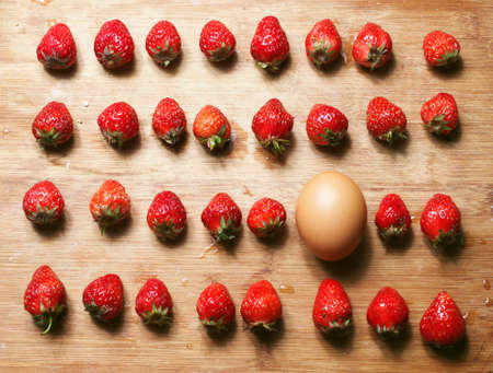 Strawberry and egg on the table
